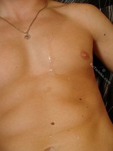 Happy twink blows his thick load all over himself