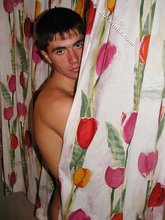 Dark-haired young boy seducing in the bathroom