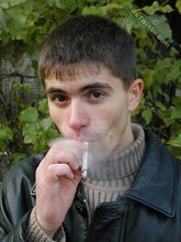 Smoking hot twink posing seductively outdoors