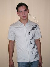 Dark-haired twink slowly but surely undressing on cam