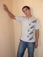 Dark-haired twink slowly but surely undressing on cam