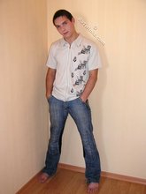 Dark-haired twink slowly but surely undressing on cam