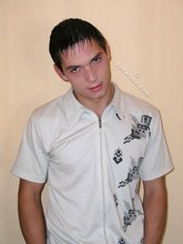 Dark-haired twink slowly but surely undressing on cam