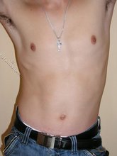 Dark-haired twink slowly but surely undressing on cam