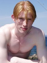 Redheaded twink shows his feet and his sexy body