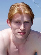 Redheaded twink shows his feet and his sexy body