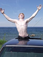 Redheaded twink shows his feet and his sexy body
