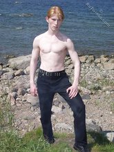 Redheaded twink shows his feet and his sexy body
