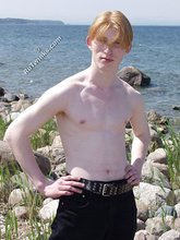 Redheaded twink shows his feet and his sexy body