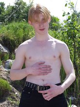 Redheaded twink shows his feet and his sexy body
