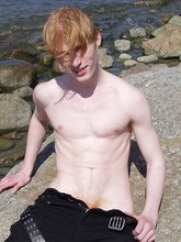 Redheaded twink shows his feet and his sexy body
