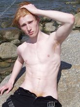 Redheaded twink shows his feet and his sexy body