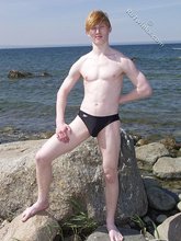 Redheaded twink shows his feet and his sexy body