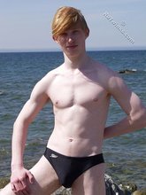 Redheaded twink shows his feet and his sexy body