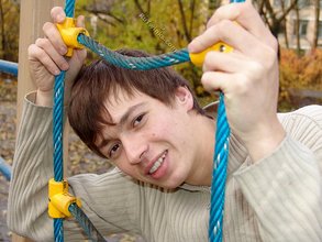 Dark-haired twink posing outdoors (with rope)