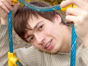 Dark-haired twink posing outdoors (with rope)