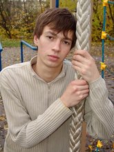 Dark-haired twink posing outdoors (with rope)