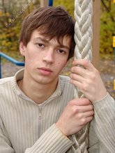 Dark-haired twink posing outdoors (with rope)