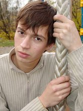 Dark-haired twink posing outdoors (with rope)