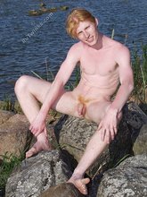 Redheaded beauty decides to piss outdoors (close-ups)