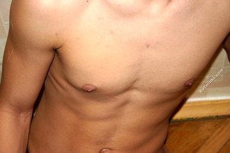 Mullet-sporting twink shows his cock in the shower