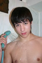 Mullet-sporting twink shows his cock in the shower