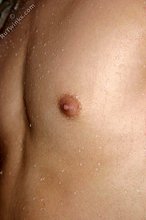 Mullet-sporting twink shows his cock in the shower