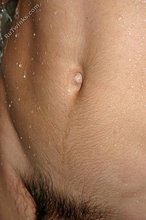 Mullet-sporting twink shows his cock in the shower