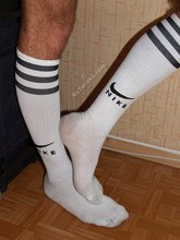 Slim brunette twink posing in his soccer outfit