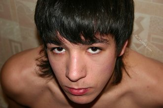 Dark-haired twink posing and flashing his sexy pubes