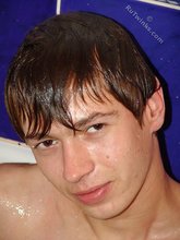 Naughty dark-haired boy posing seductively in the bathroom