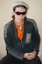 Shades-wearing twink posing seductively on camera