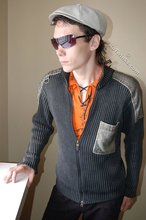 Shades-wearing twink posing seductively on camera