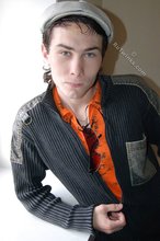 Shades-wearing twink posing seductively on camera