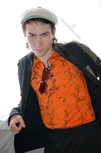 Shades-wearing twink posing seductively on camera
