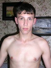 Hairy cock twink posing with his legs spread wide apart