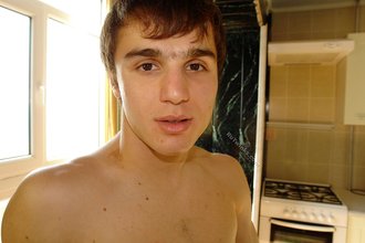 Dark-haired hottie showing his cock up close