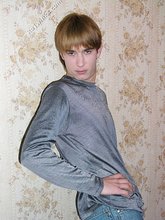 Stylish twink posing with his shirt off on the floor