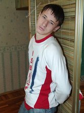 Pouty dark-haired guy shows his sexy arms and abs