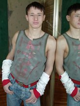Pouty dark-haired guy shows his sexy arms and abs