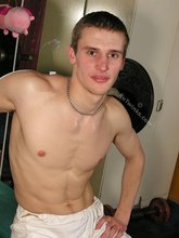 White pants horny-looking twink shows off his cock