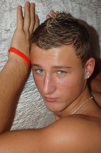 Tanned blond-haired twink showing his sexy feet
