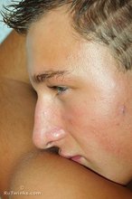 Tanned blond-haired twink showing his sexy feet