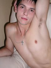 Dark-haired twink spreading his sexy legs on cam