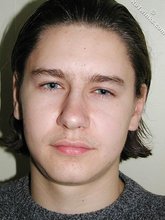 Baby-faced brunette twink shows off his abs on cam
