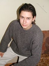 Baby-faced brunette twink shows off his abs on cam