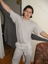 Baby-faced brunette twink shows off his abs on cam