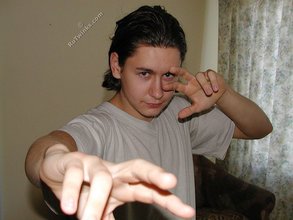 Baby-faced brunette twink shows off his abs on cam
