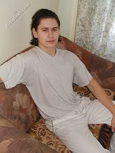 Baby-faced brunette twink shows off his abs on cam