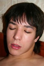 Dark-haired young boy waves you goodbye after an orgasm